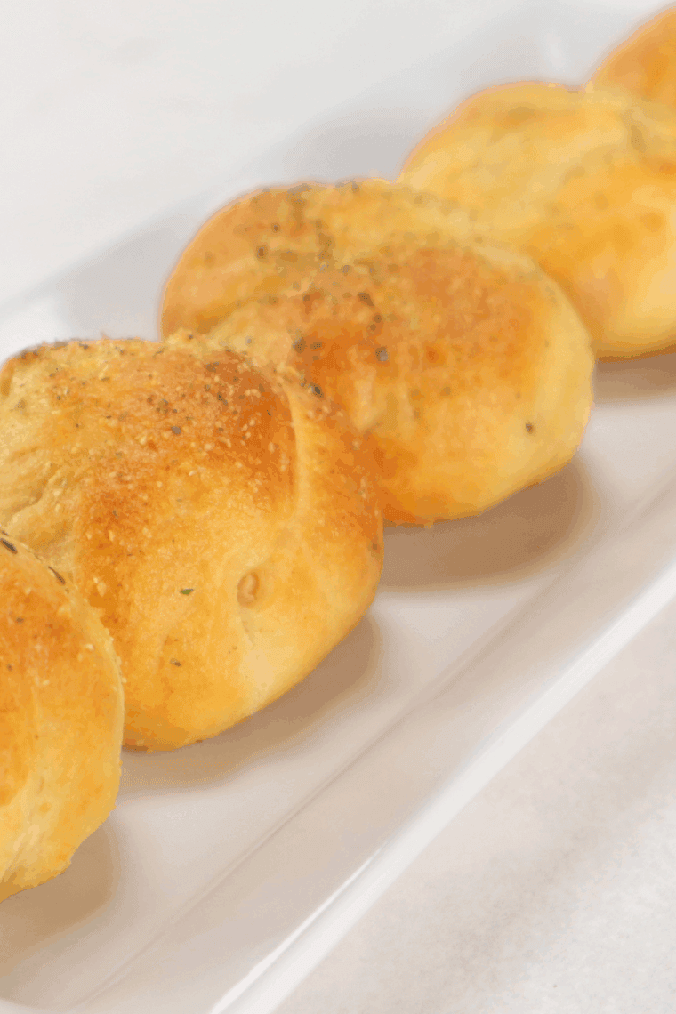 Air fryer bacon-wrapped cheese bombs with melted cheese oozing inside