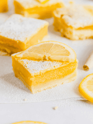 Air fryer lemon bars with golden crust and smooth, tangy lemon filling, dusted with powdered sugar.