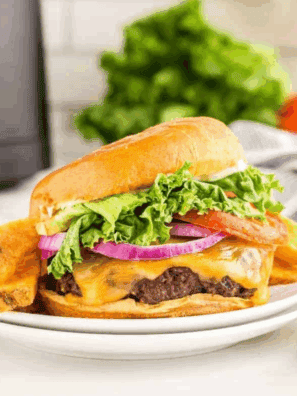 Homemade copycat Sonic Drive-In burger with juicy beef patty, lettuce, tomato, and bun