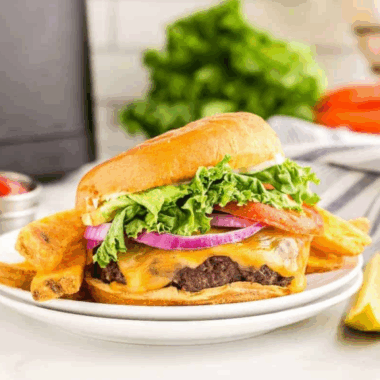 Homemade copycat Sonic Drive-In burger with juicy beef patty, lettuce, tomato, and bun