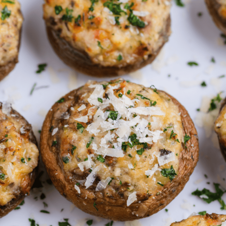 Delicious Longhorn Stuffed Mushrooms filled with a creamy cheese blend, topped with a crispy golden crust, and served as a perfect appetizer.