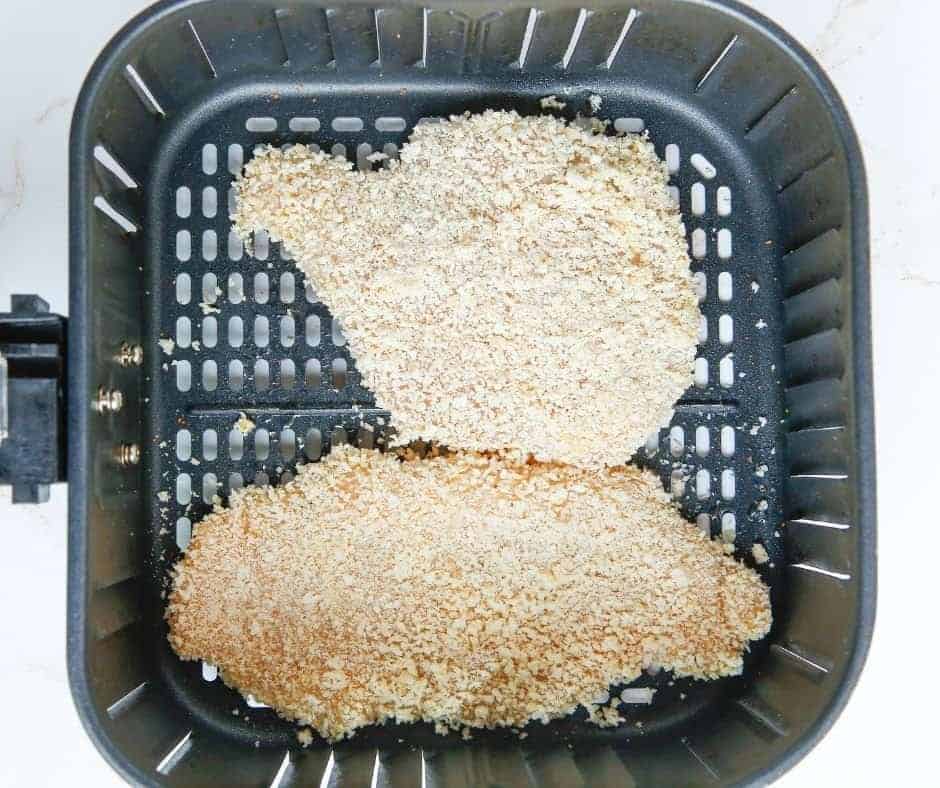 chicken schnitzel in air fryer basket