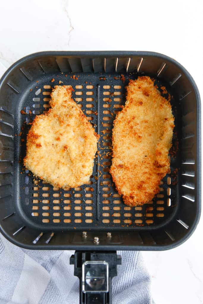 cooked german chicken in a basket