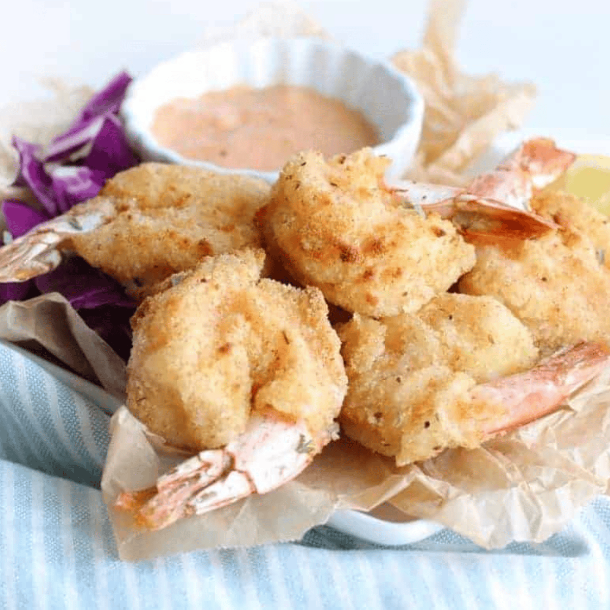 Golden, crispy Air Fryer Beer Battered Shrimp on a plate, ready to enjoy.