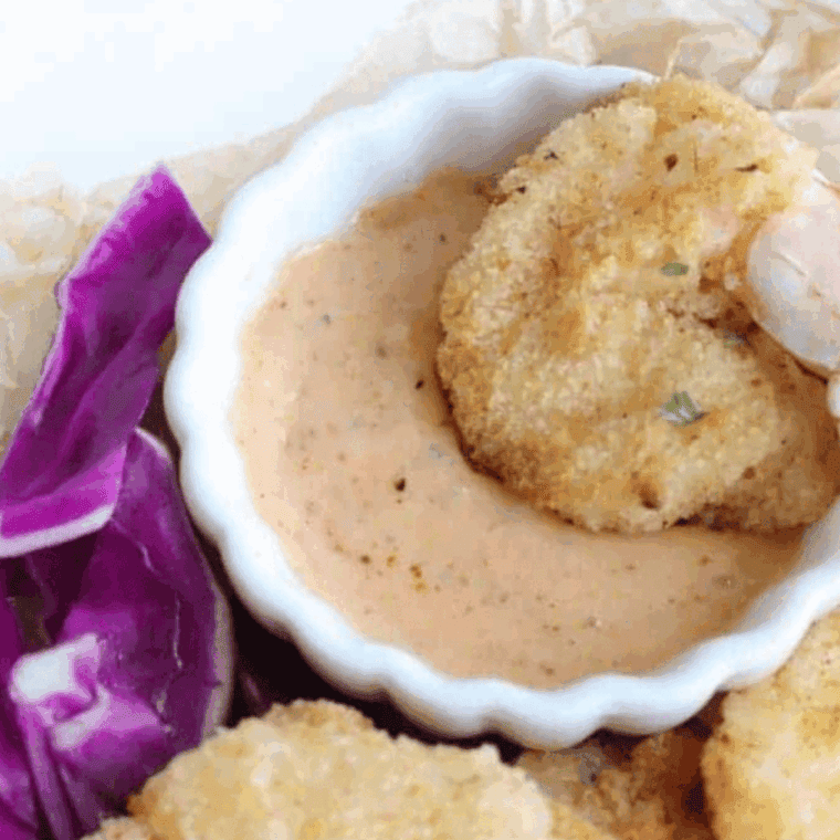 Golden, crispy beer battered shrimp cooked in the air fryer, served as a delicious seafood appetizer or main dish.