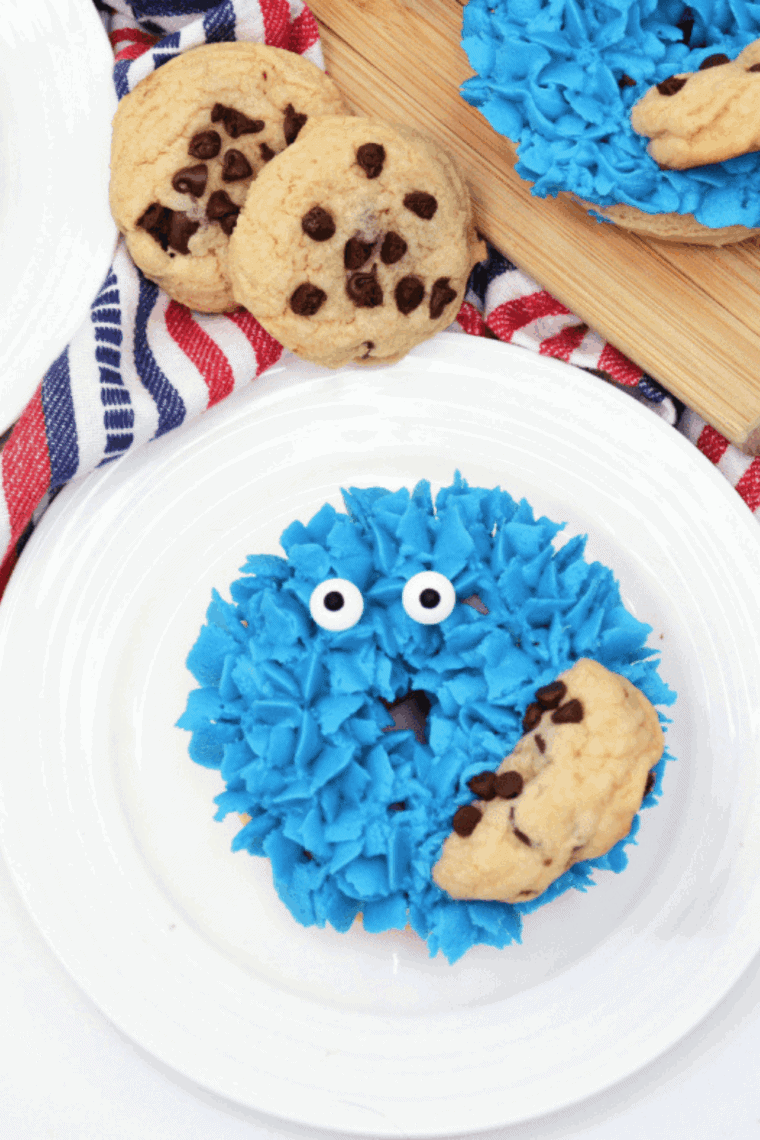 Blue Cookie Monster donuts with frosting, cookie pieces, and candy eyes
