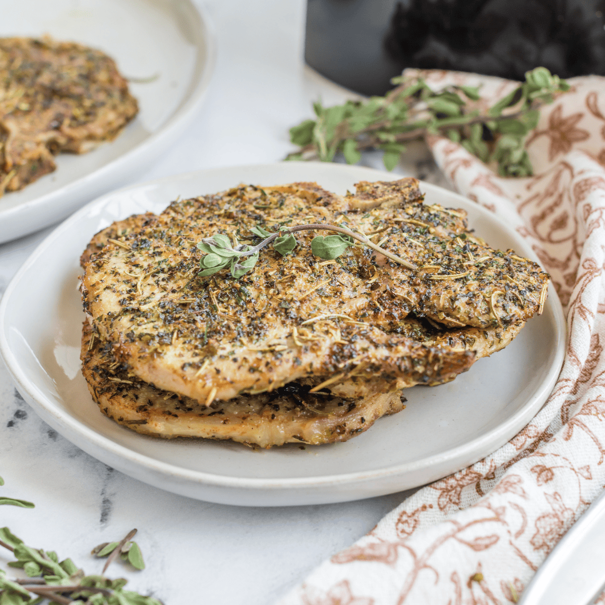 Golden, crispy Air Fryer Italian Pork Chops, seasoned with Italian herbs and ready to serve for a tasty dinner.