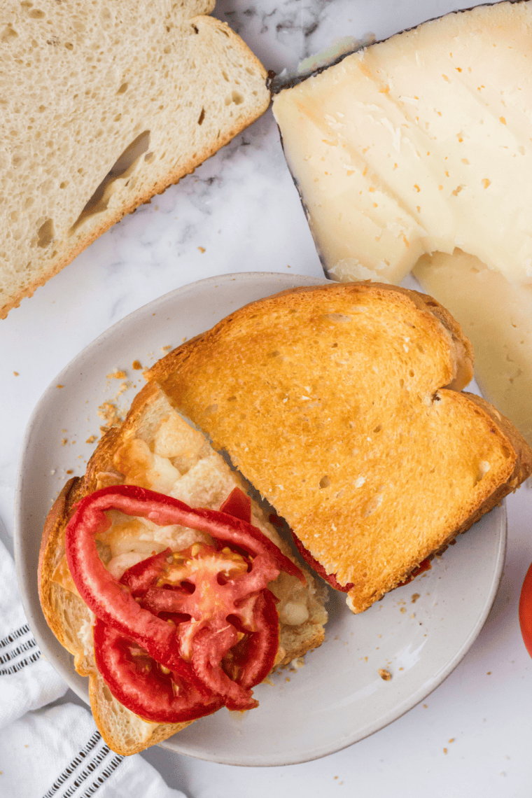 Golden crispy Air Fryer Spanish Manchego grilled cheese sandwich with melted cheese oozing and toasted sourdough.