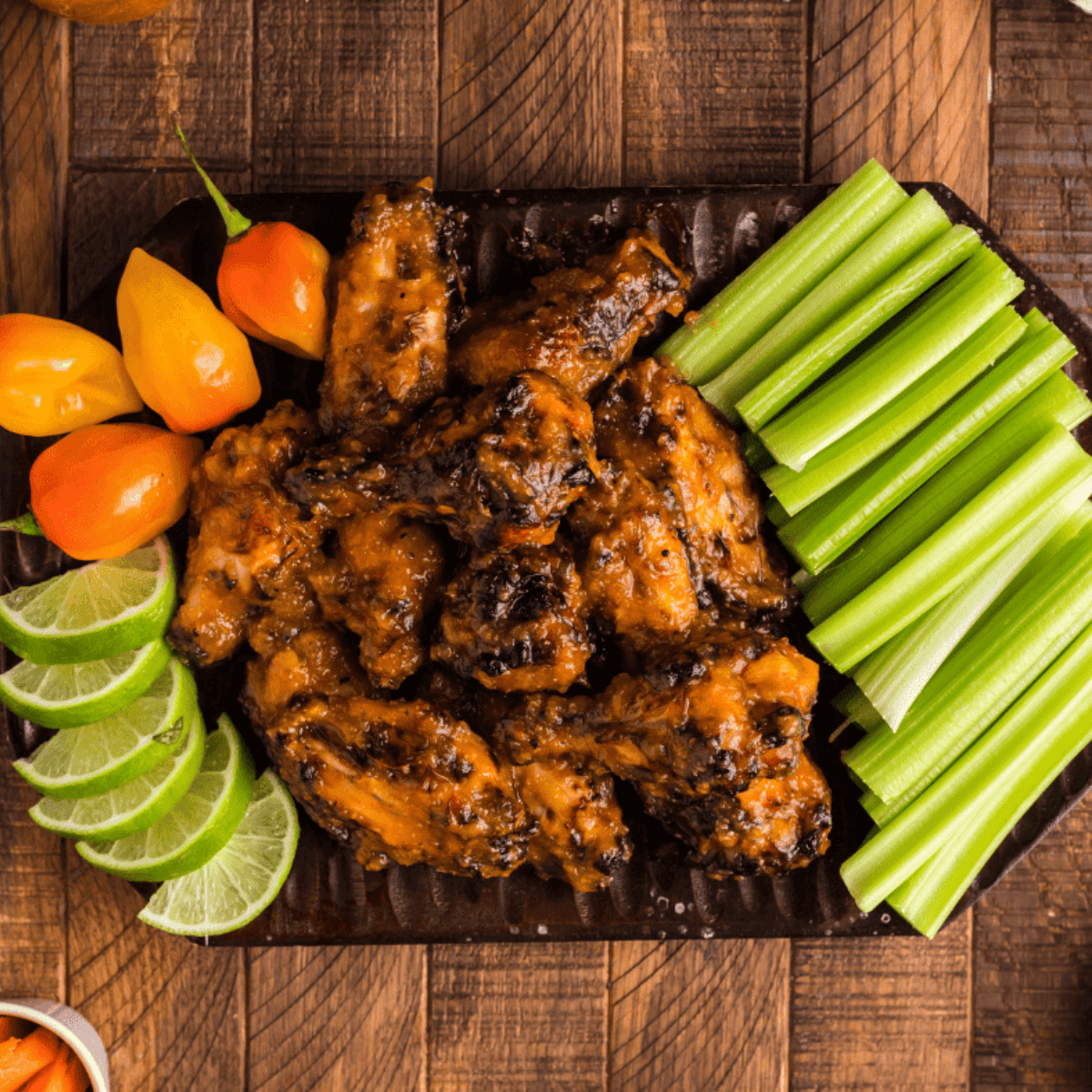 Serve saucy mango habanero wings with ranch, blue cheese, and celery for a restaurant-style meal at home.