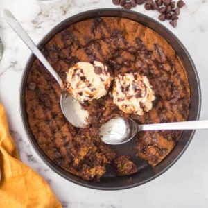 pan with a pizookie and two spoons