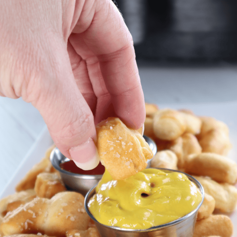 Close-up of crispy air fryer bite-size pretzels sprinkled with kosher salt
