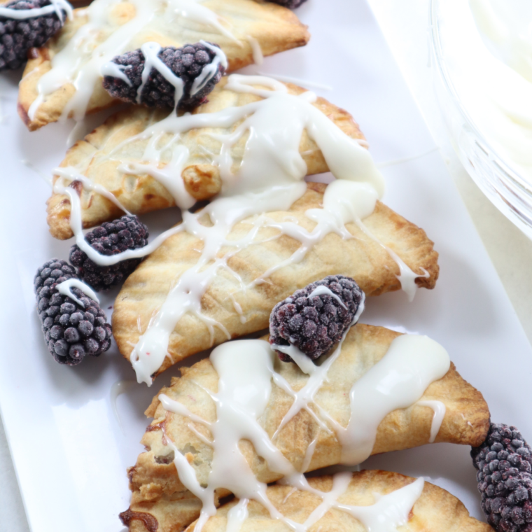 "Serving finished blackberry air fryer hand pies on a plate