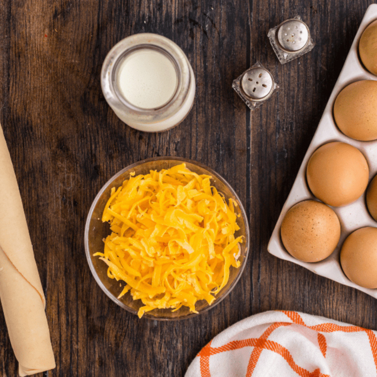 Ingredients needed for air fryer white quiche on kitchen table.