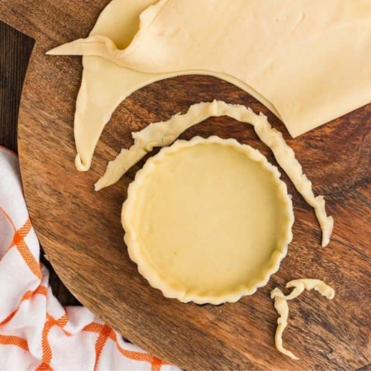 Rolling out pie crust for Air Fryer Egg White Quiche