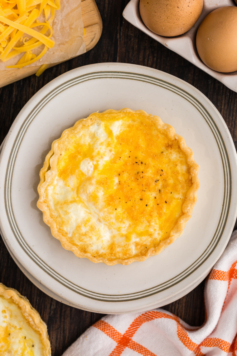 Air Fryer Egg White Quiche with vegetables and cheddar cheese in a flaky pie crust.