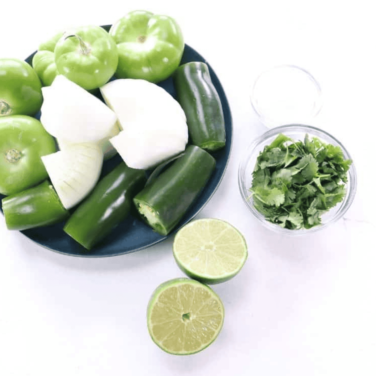 Ingredients needed for Air Fryer Salsa Verde on kitchen table.