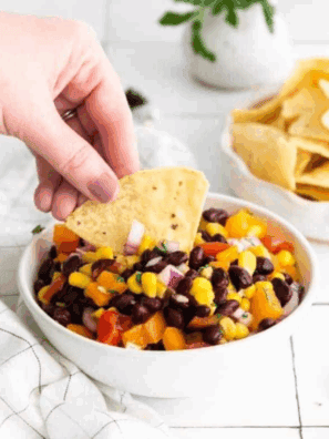 Bowl of homemade Applebee’s black bean and corn salsa with chips