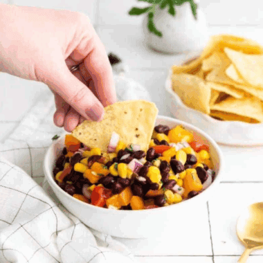 Bowl of homemade Applebee’s black bean and corn salsa with chips