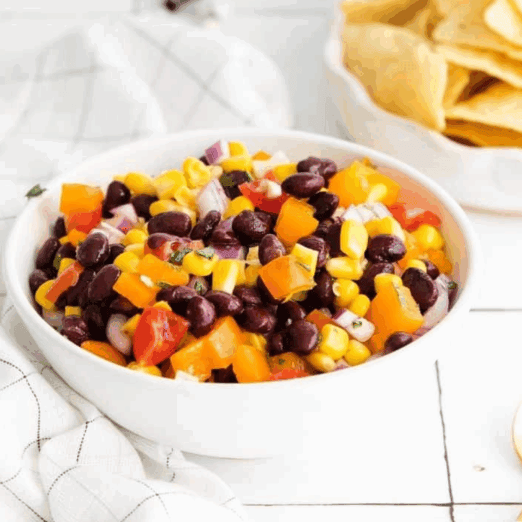 Applebee’s black bean and corn salsa served in a bowl with tortilla chips
