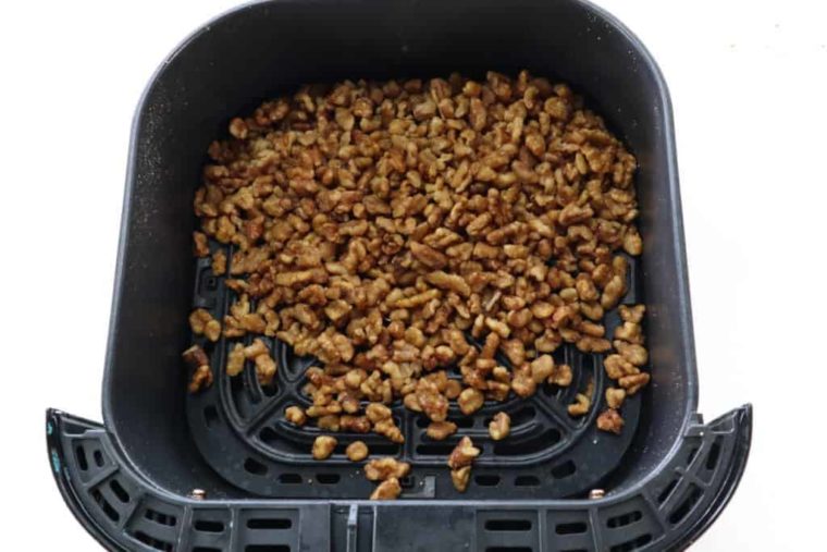 overhead process shot: candied walnuts in air fryer basket