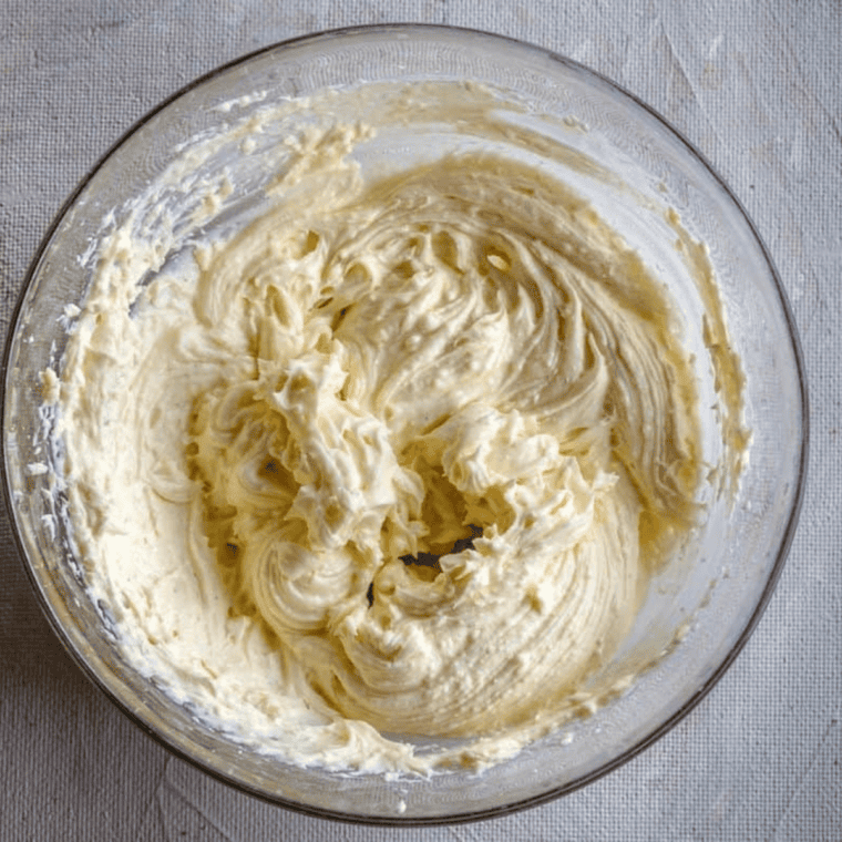 Cream cheese at room temperature in a bowl ready for frosting