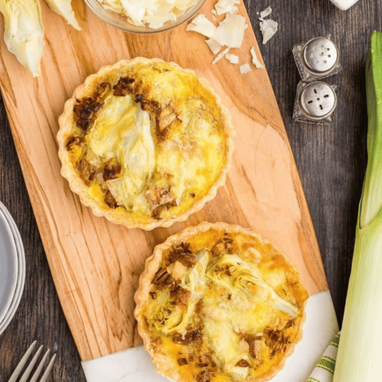 To make Air Fryer Caramelized Leeks and Artichoke Quiche, follow these steps: