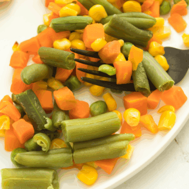 Air fryer frozen vegetables cooked to crispy perfection, ready to serve.