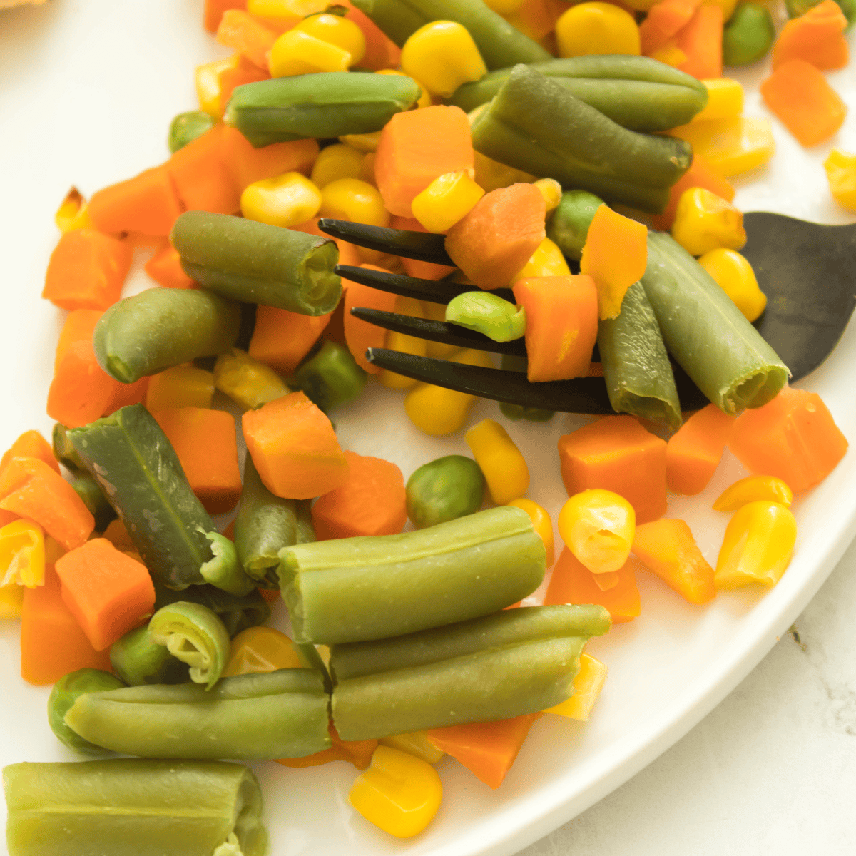 Air fryer frozen vegetables cooked to crispy perfection, ready to serve.