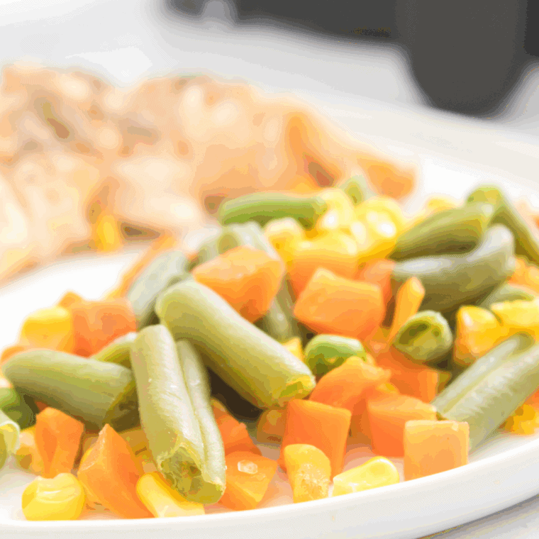 Air fryer frozen vegetables cooked to crispy perfection, ready to serve.