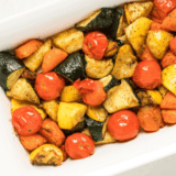 Colorful air fryer roasted vegetables including carrots, broccoli, and bell peppers served in a bowl.