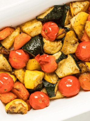 Colorful air fryer roasted vegetables including carrots, broccoli, and bell peppers served in a bowl.