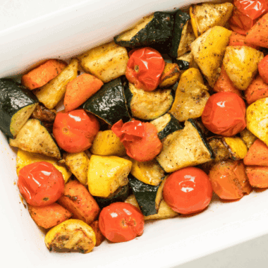 Colorful air fryer roasted vegetables including carrots, broccoli, and bell peppers served in a bowl.