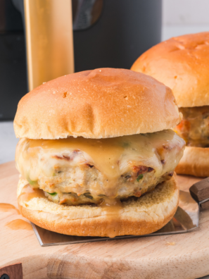 Crispy air fryer salmon burgers served on toasted buns with lettuce and sauce
