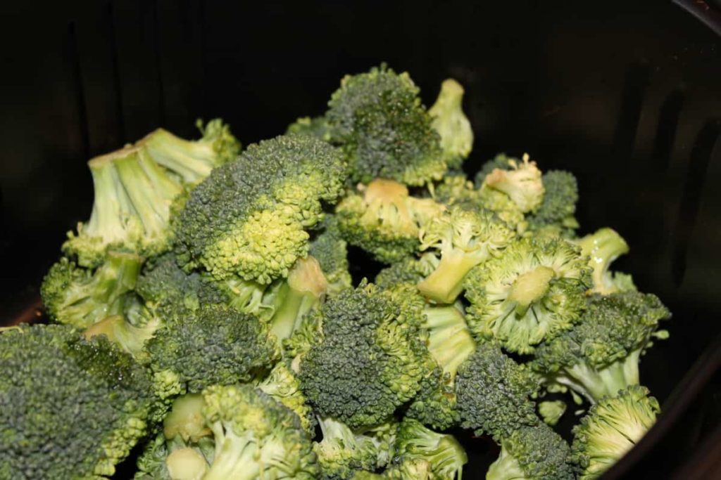 broccoli florets in air fryer basket