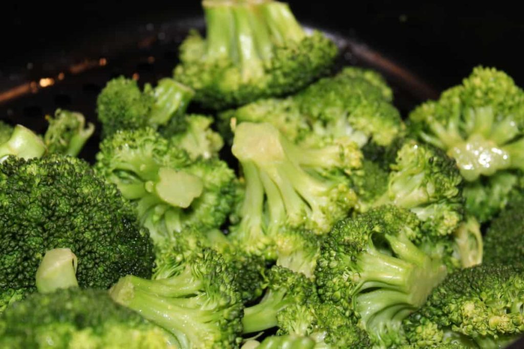 close up of roasted broccoli in air fryer