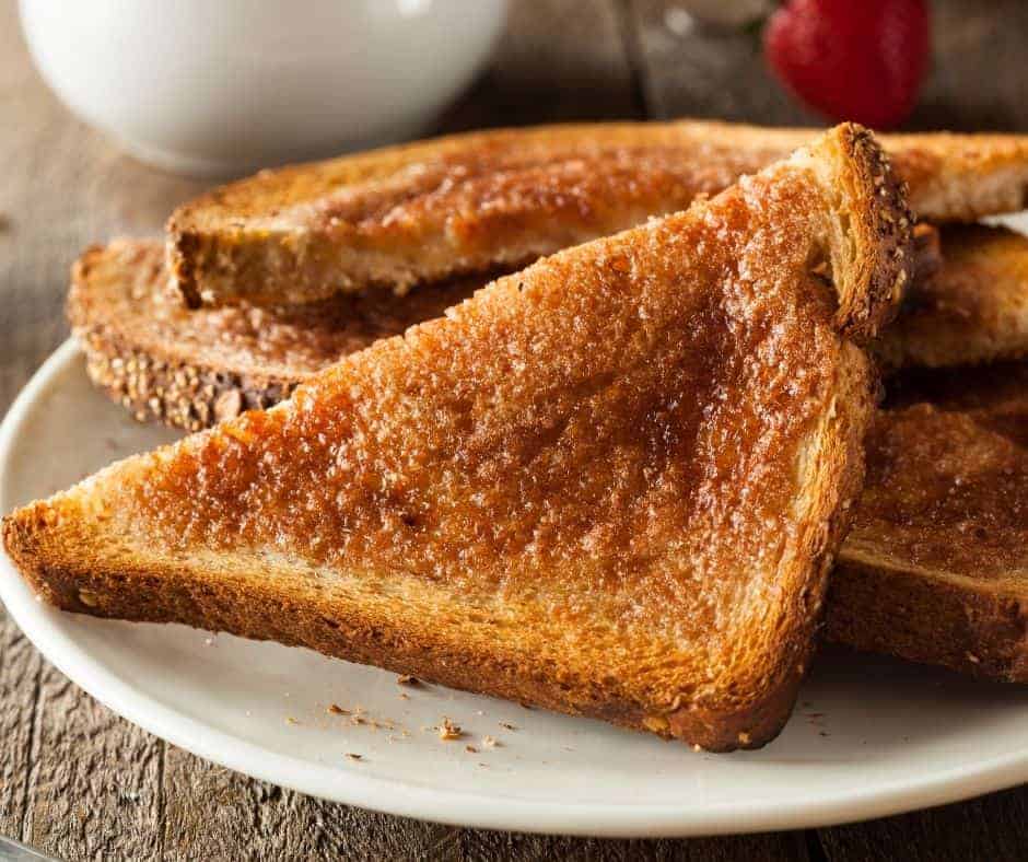 triangle slices of toast on a white plate