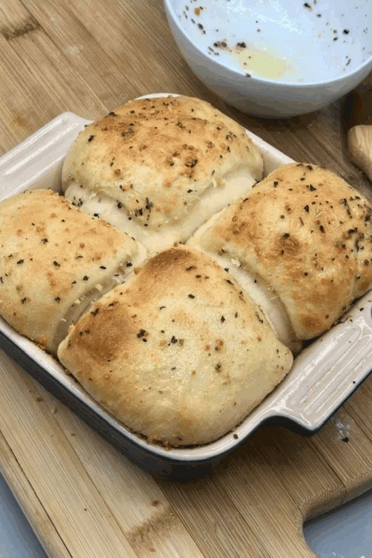 Air fryer cheese stuffed garlic rolls with golden crust and melted cheese.
