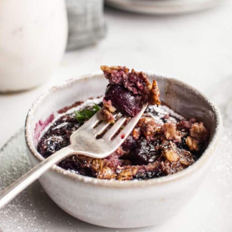 Cherry Oatmeal air fryer cooked and in bowl, with a spoon