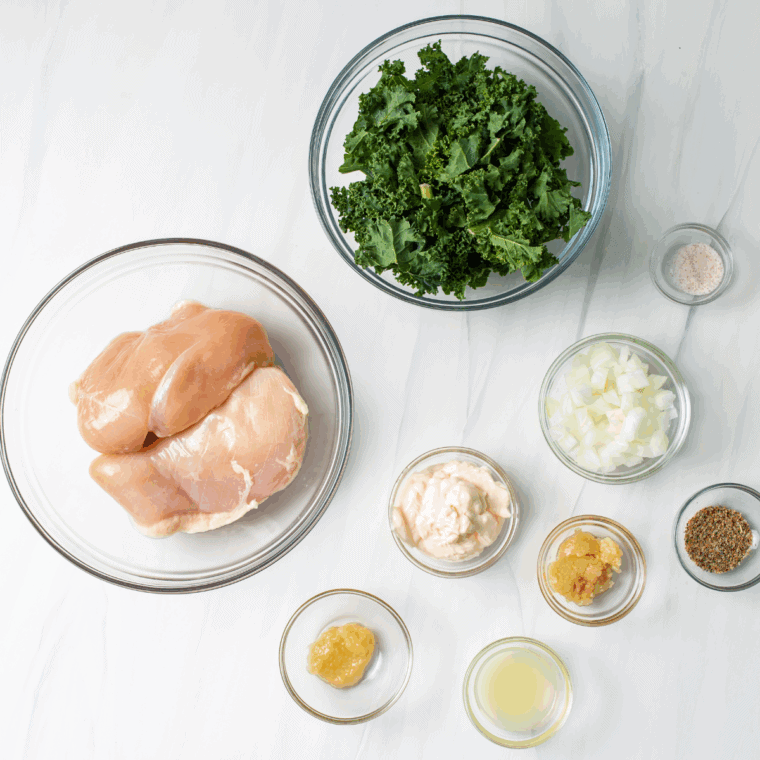 Ingredients needed for Air Fryer Feta and Spinach Stuffed Chicken Breasts on kitchen table.