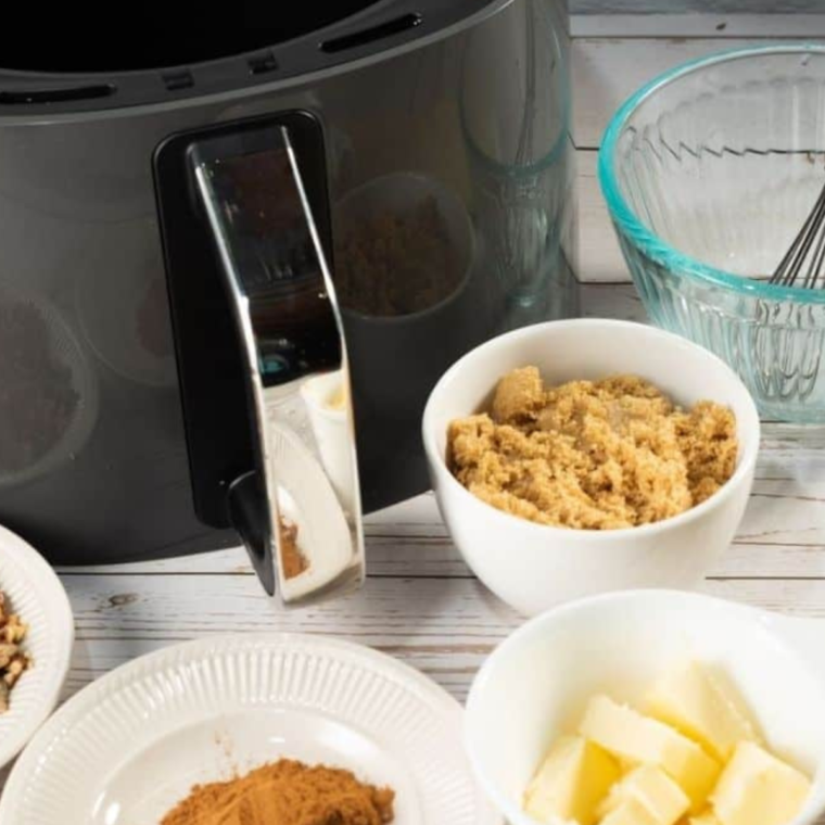 Ingredients needed for Air Fryer Puff Pastry Cinnamon Rolls on kitchen table.