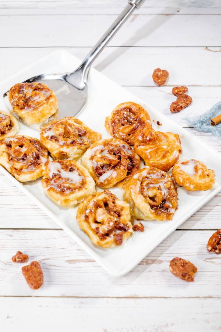 Air Fryer Puff Pastry Cinnamon Rolls drizzled with glaze