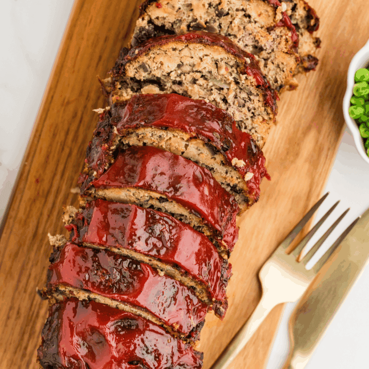 Air fryer turkey meatloaf cooked to golden perfection, sliced and served.