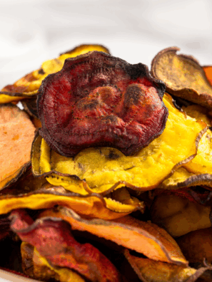 Air Fryer Copycat Terra Vegetable Chips made from colorful root vegetables served on a rustic platter.