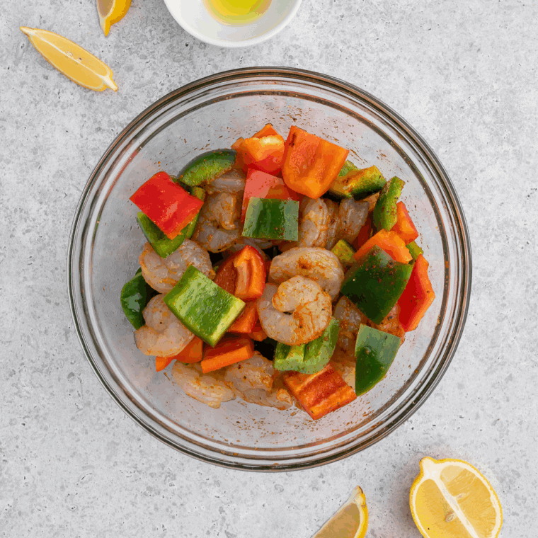 Shrimp, bell peppers, and garlic marinating in soy, hoisin, and sesame oil.