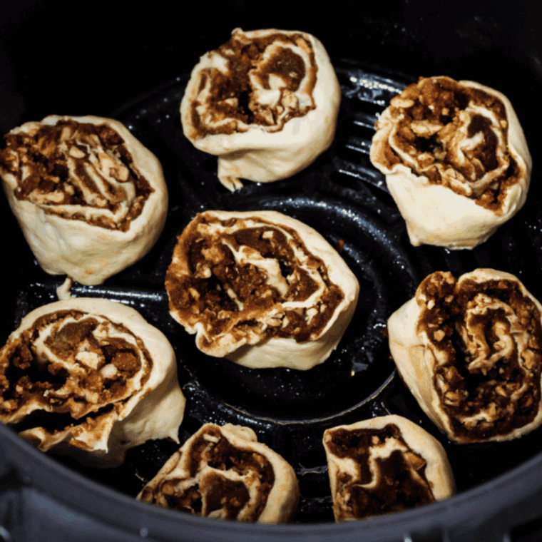 Place prepared Panera Cinnamon Roll Recipe in the air fryer basket.