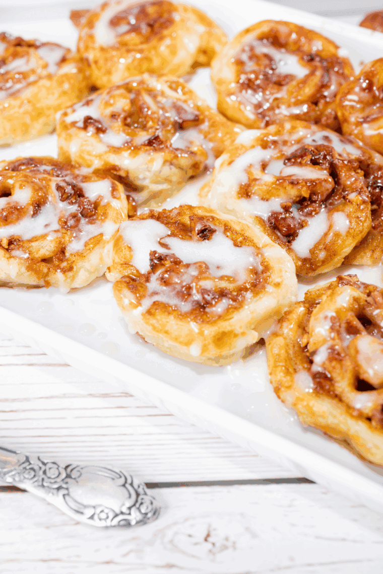 Panera-style cinnamon rolls made with puff pastry and creamy glaze.