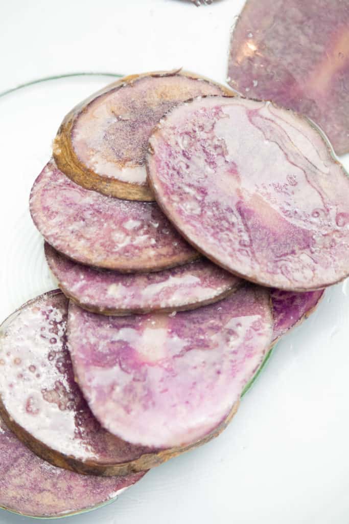 extreme closeup: sliced purple potatoes to make vegetable chips in air fryer