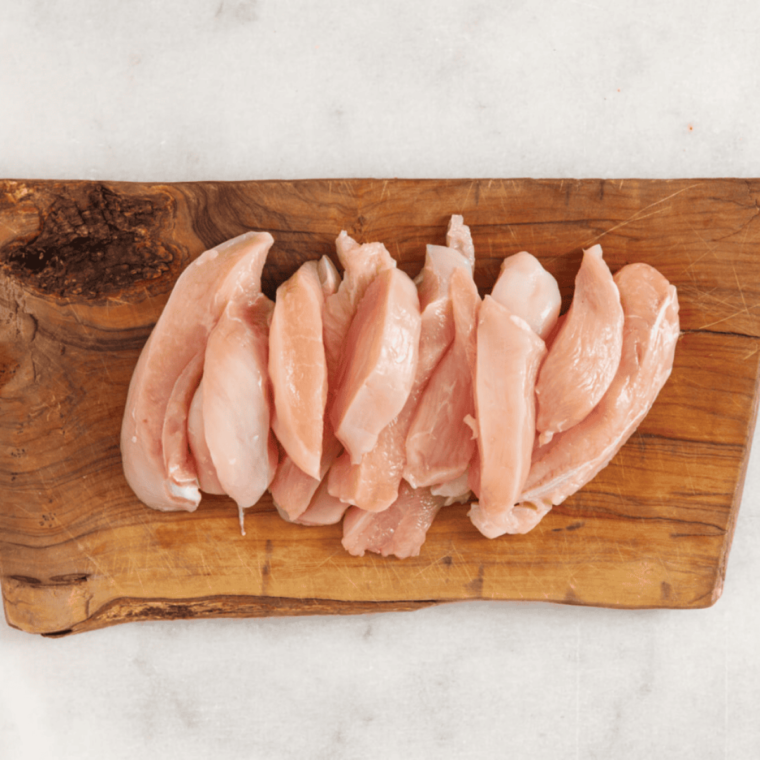 Ingredients needed for air fryer Chinese chicken fingers on wooden cutting board.