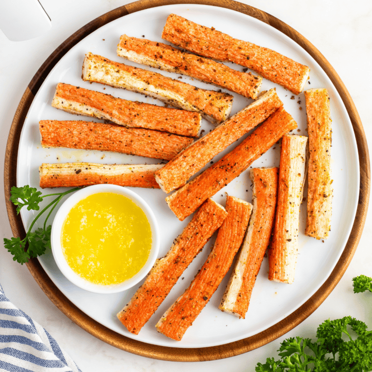 Bite-sized imitation crab pieces coated in butter and seasoning before air frying.
