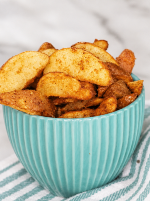 Crispy golden air fryer frozen potato wedges served in a white bowl